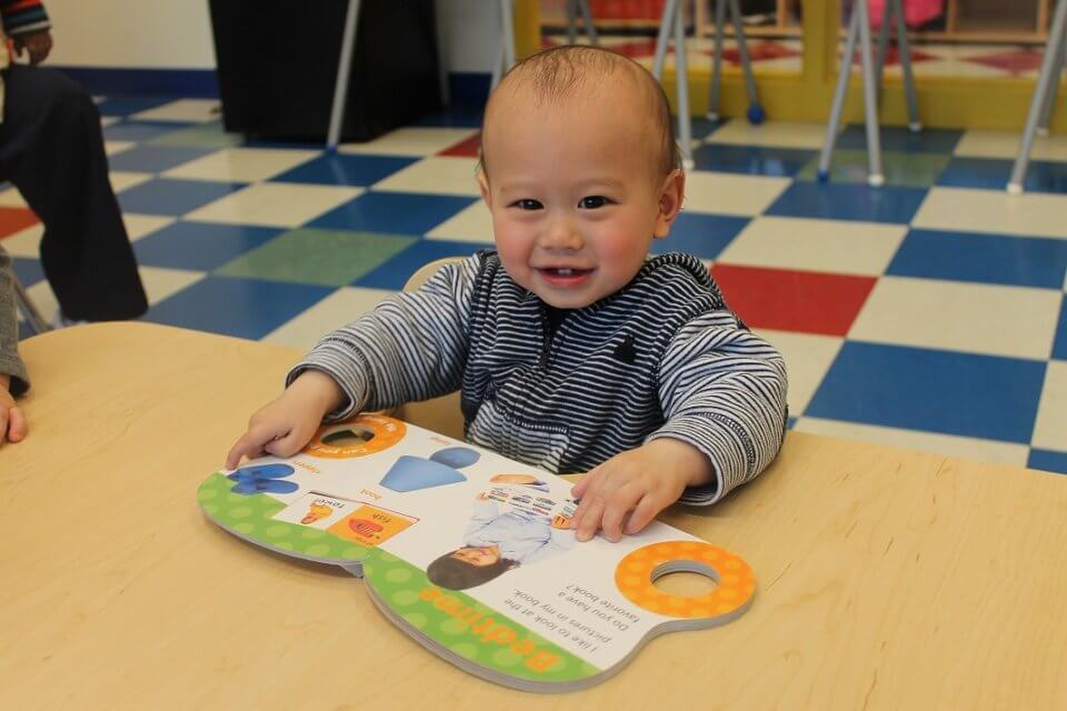 Infant at daycare reading