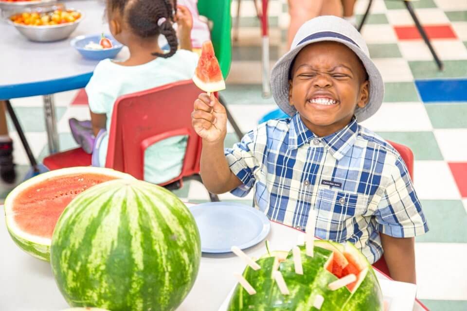 Child eating watermelon at child care centre