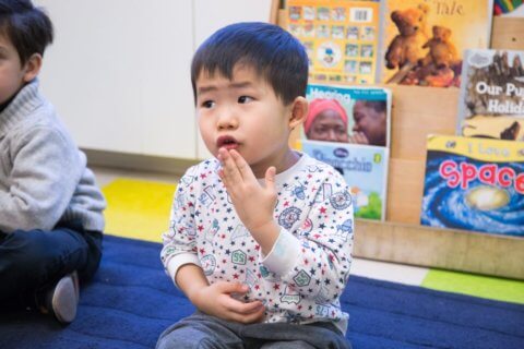 Child learning sign language