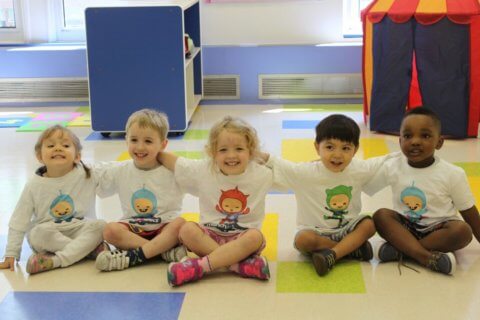 Preschoolers wearing munchkinetics tshirts