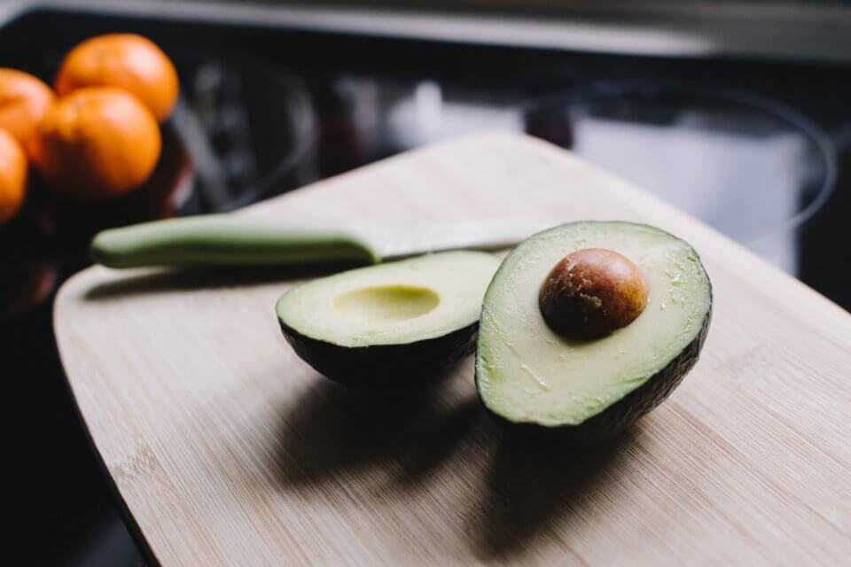 Avocado on a wood cutting board