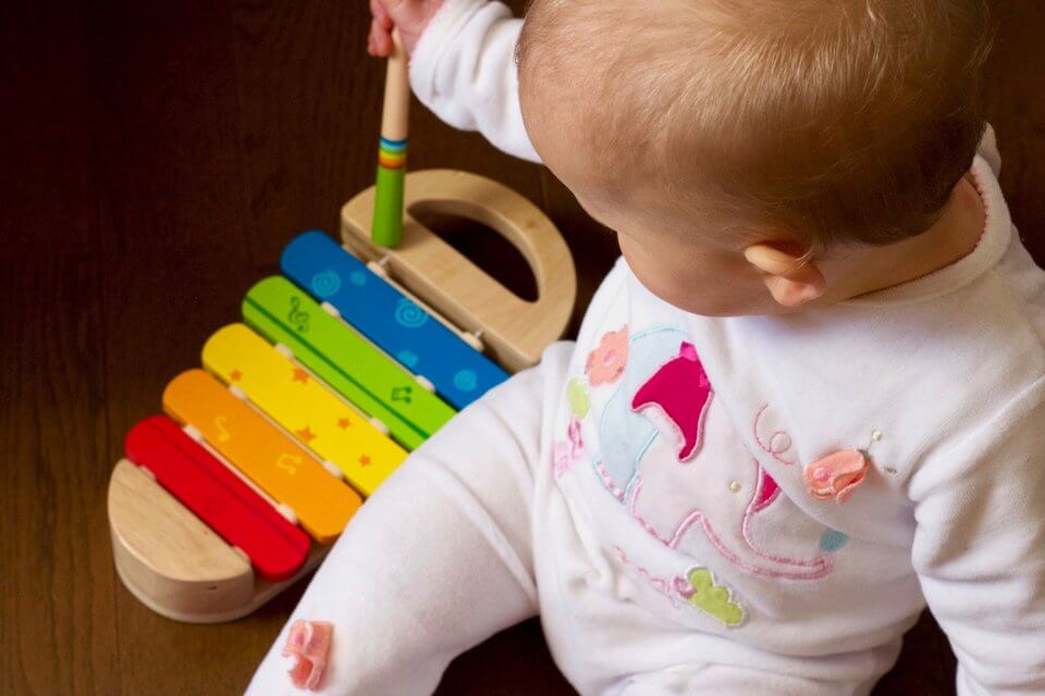 Child playing a musical instrument