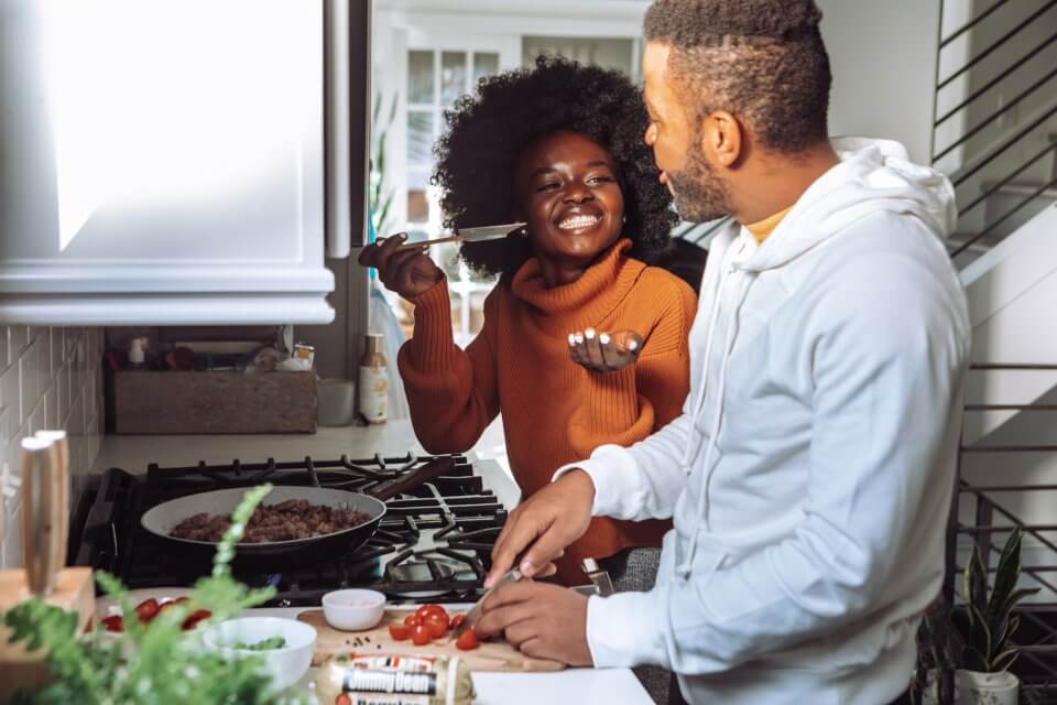 Family cooking a meal together in the kitchen