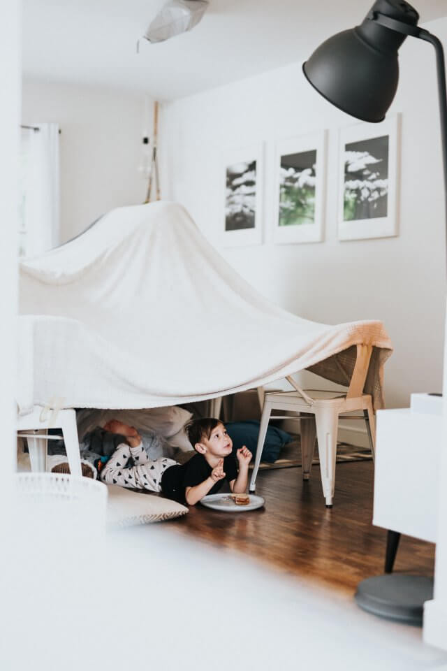 Child building a fort together