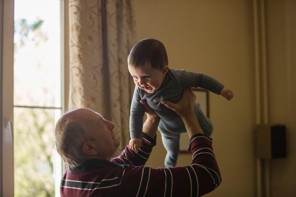 Grandpa with his grandson in the air