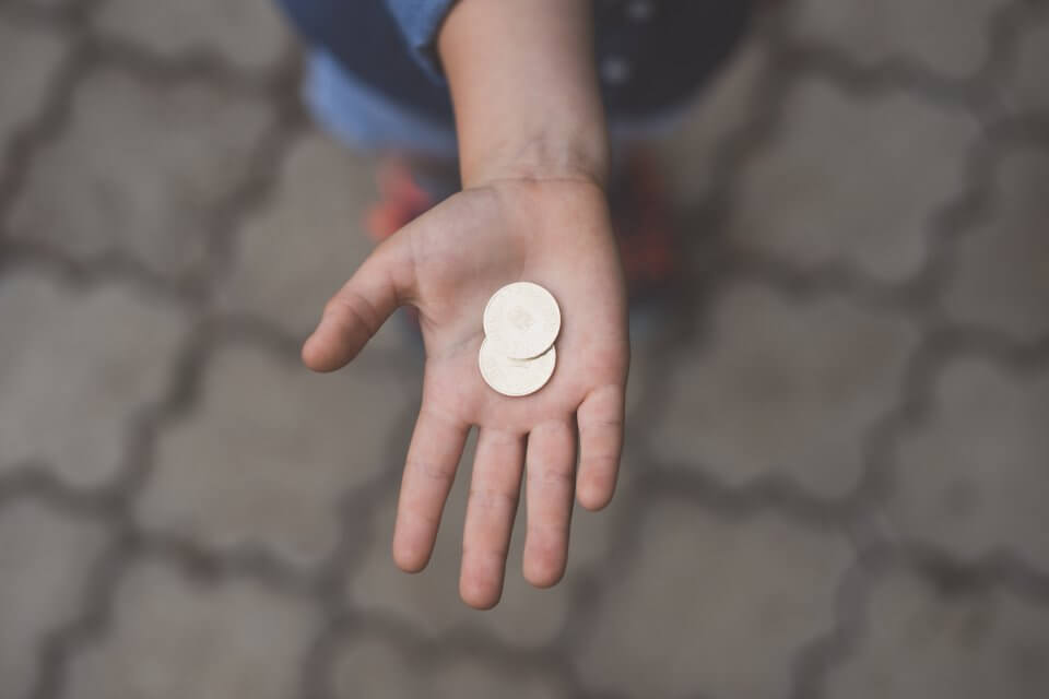 Child hand holding change