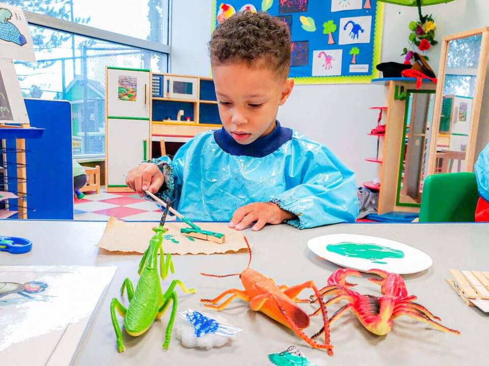 Child enjoying learning about insects