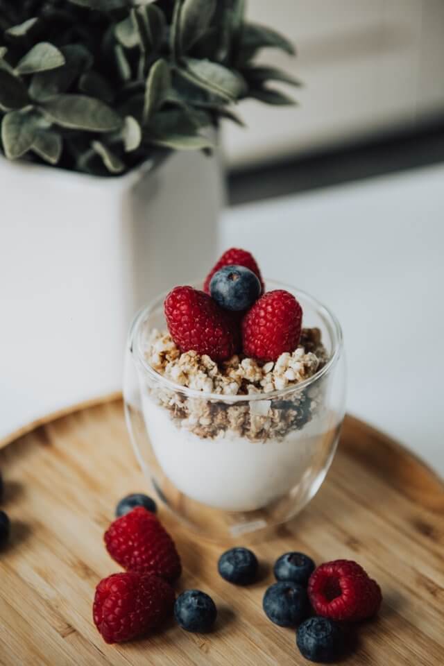 Yogurt and granola with berries on top
