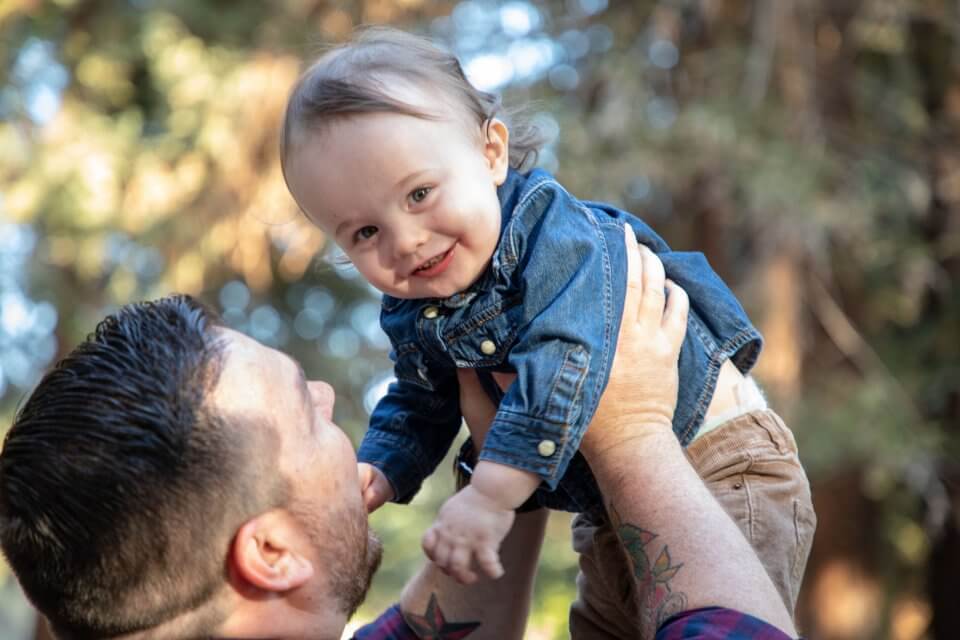 Father holding his child above his head