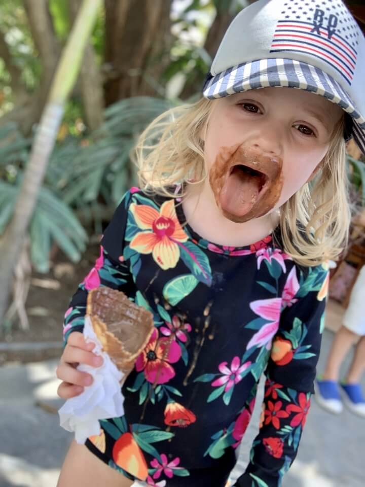 Child with icecream, tongue out!