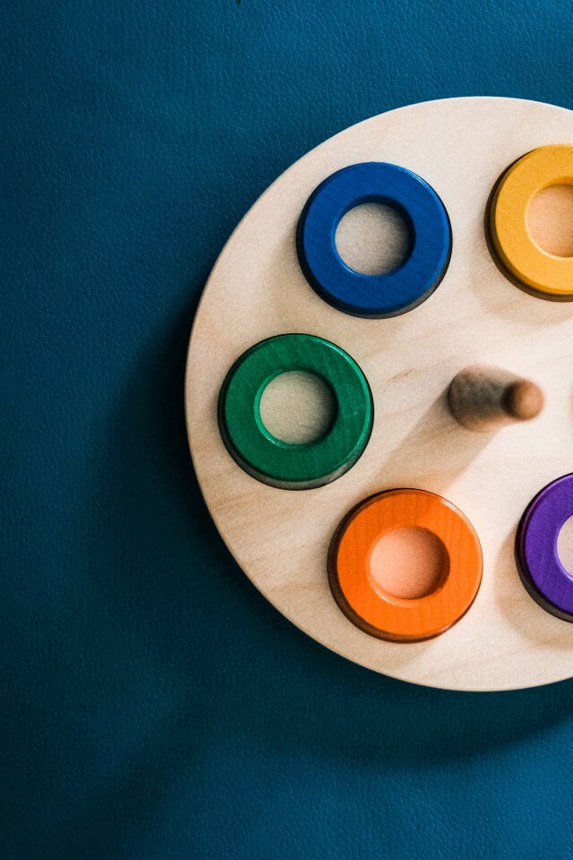 child's montessori toy on a blue background